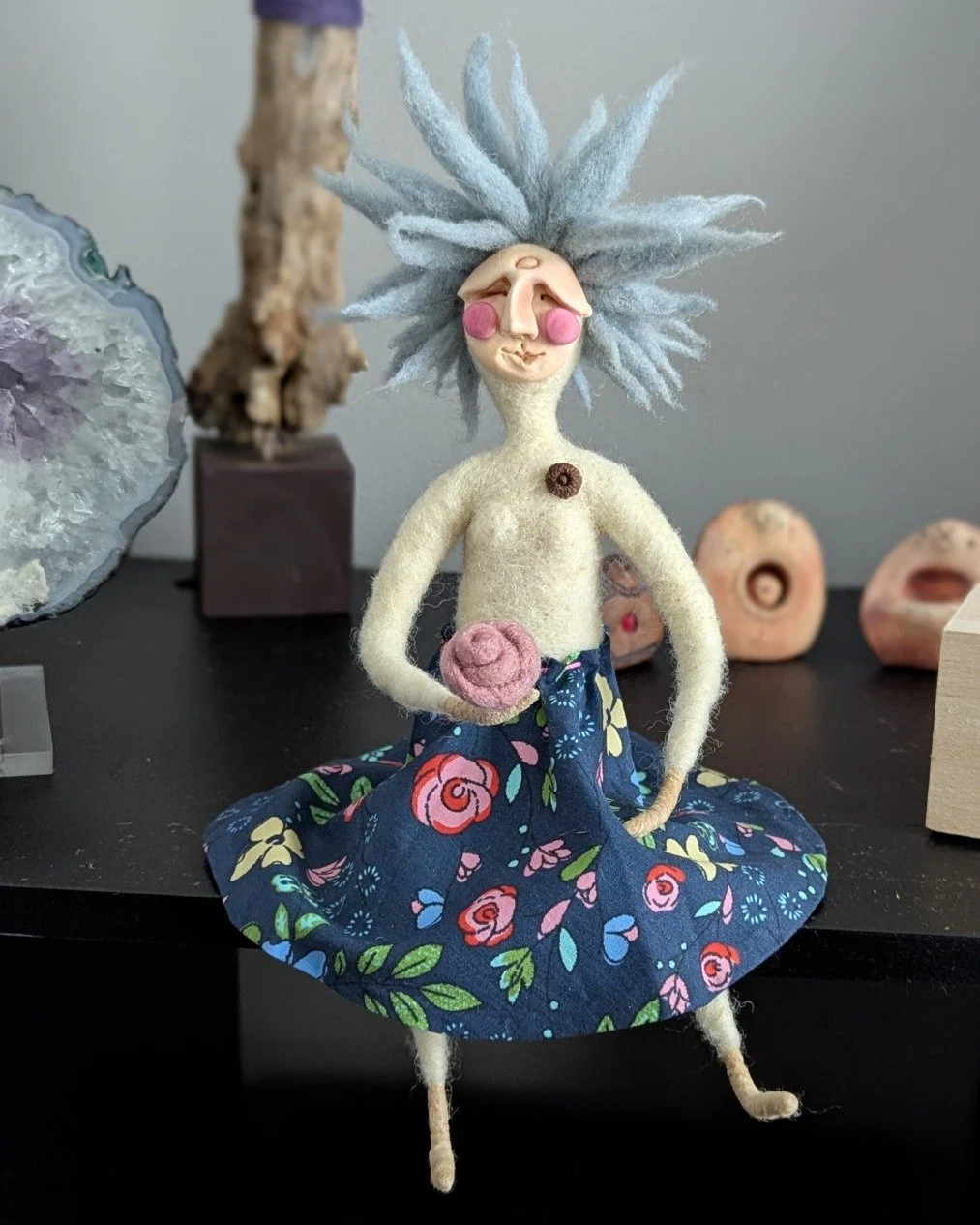 Meet Gertie. I made her this week as a gift for a friend&rsquo;s new home, needle-felting that wild blue hair until she finally settled on her favorite floral skirt. 

There is something deeply grounding about this process&mdash;tucking a bit of quie