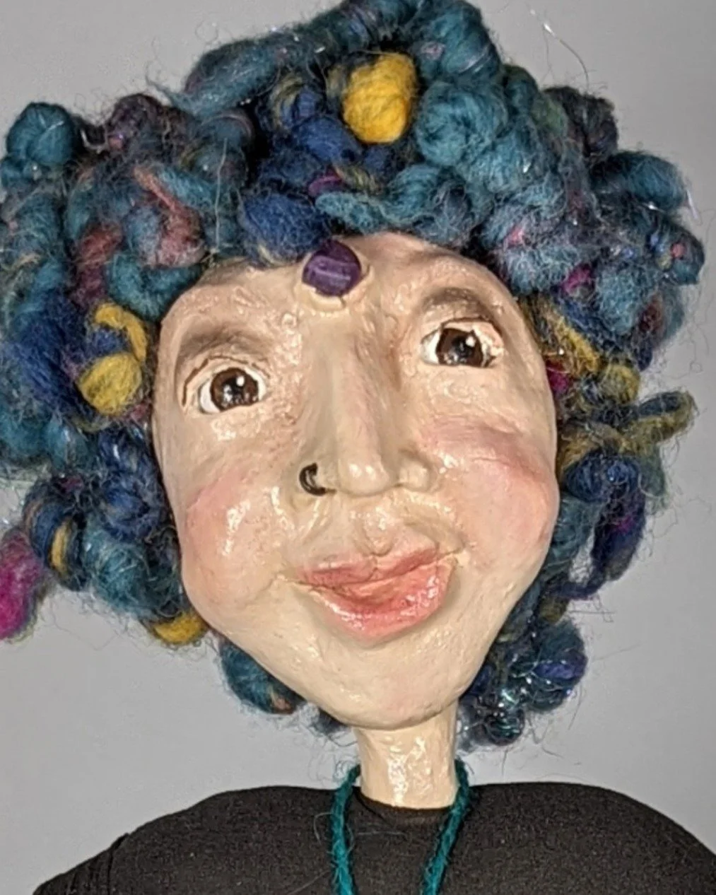 This face took about an hour to sculpt.

And then she just... sat there looking at me like she already knew things.

That's the part nobody warns you about when you start making spirit dolls. You think you're making something. And then somewhere in t