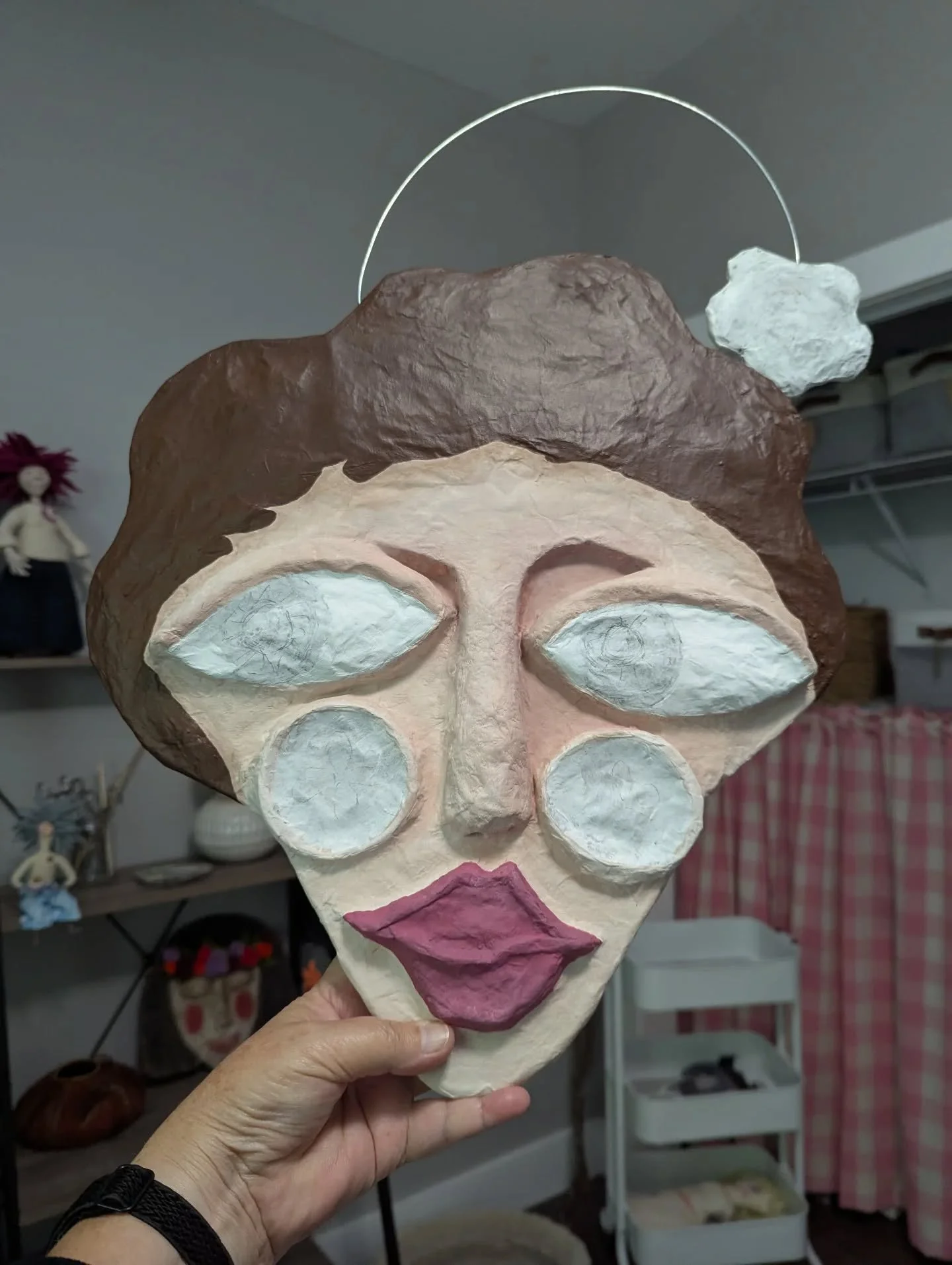 My grandma used to always say, 'hang on, I got to put my face on,' whenever she got ready to do her makeup. And every time I start to paint a little face I always think of that. 

My little flower lady here is putting her face on. She looks a little 