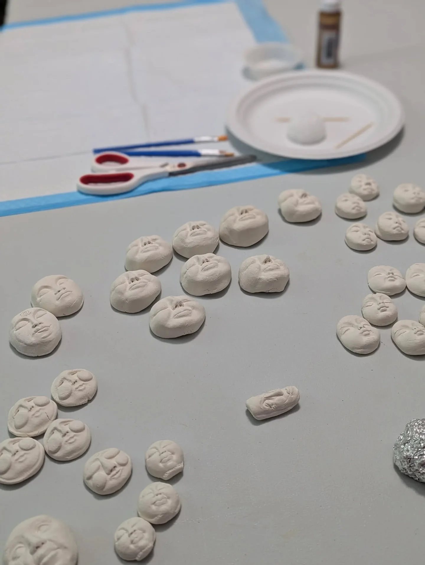 Gettin' ready for tomorrow's Stick Doll Workshop. Faces, faces, and more faces... I wonder who will get picked?!