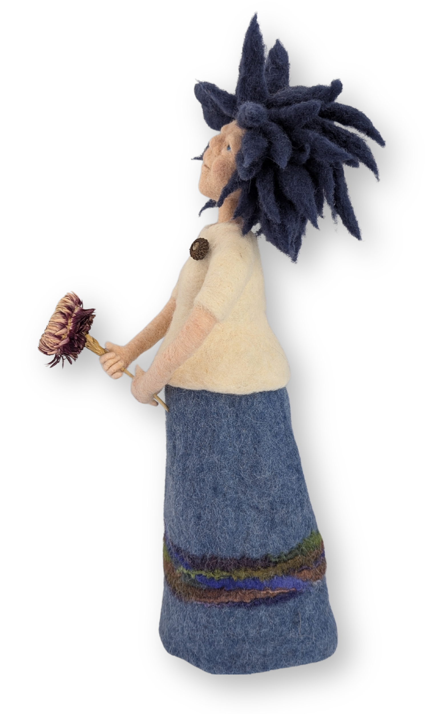 Left side view of Dreamer Guardian Doll holding a flower, showcasing the soft felt textures of her clothing and hair.