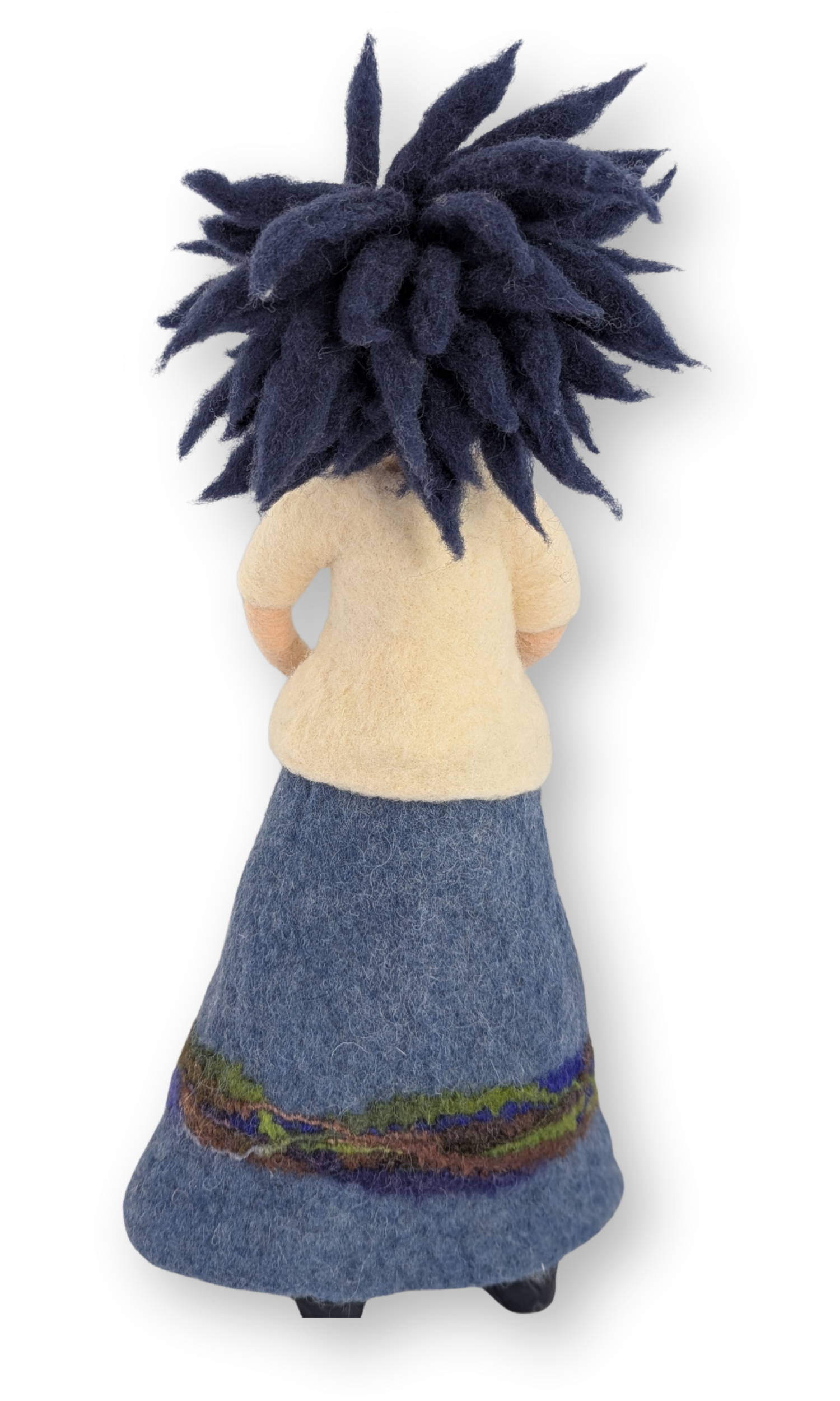 Rear view of Dreamer Guardian Doll highlighting the layered, spiky navy wool hair and the shape of her felted skirt.