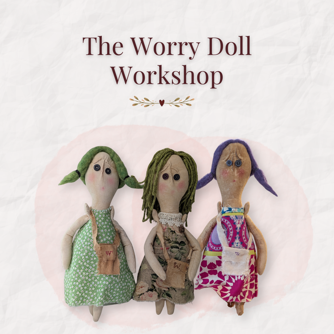 Three handmade Worry Dolls with fabric dresses, yarn hair, button eyes, and small stitched pockets beneath the words “The Worry Doll Workshop.”