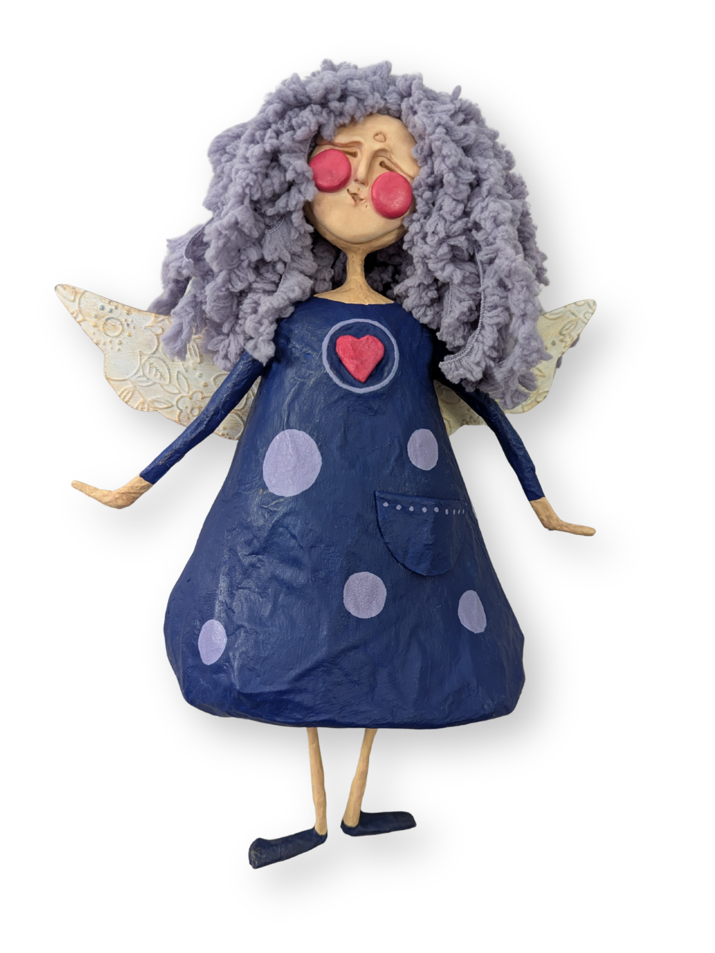 Finished papier-mâché angel with lavender yarn hair, textured wings, and a blue painted dress.