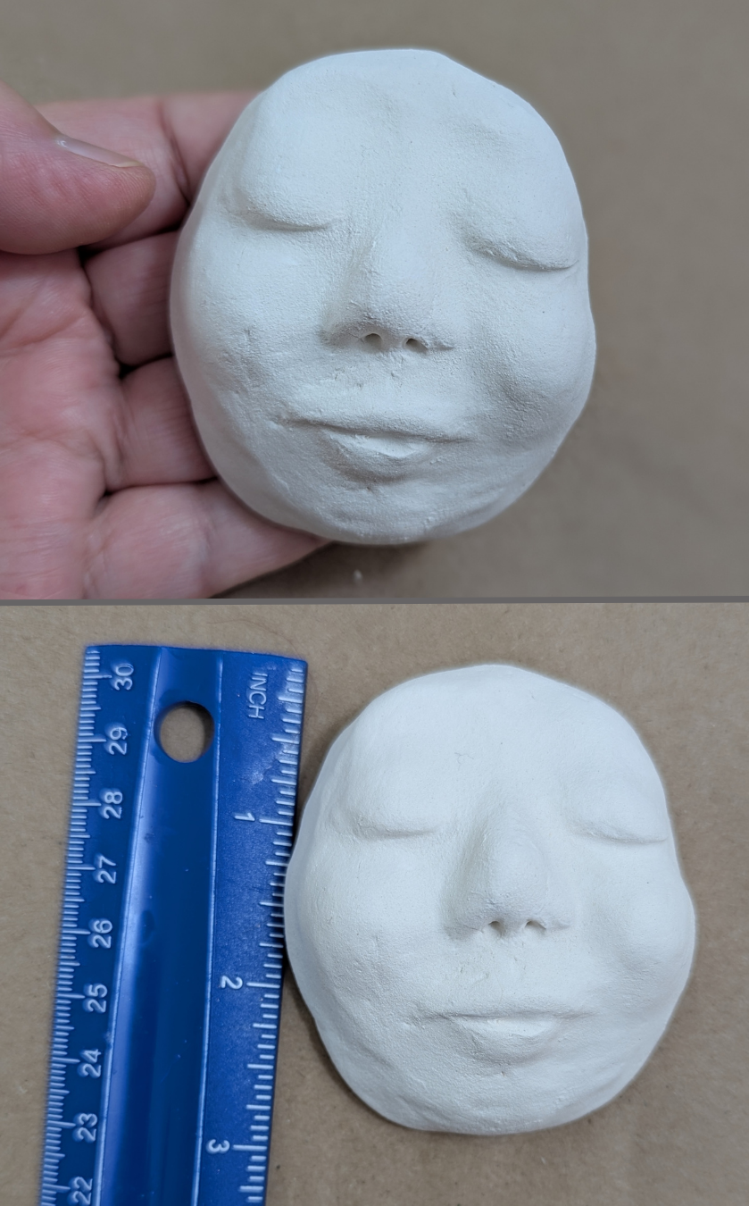 Two-photo image of a large handmade paper-clay starter face with closed eyes, shown held in hand above and beside a ruler below for size reference.