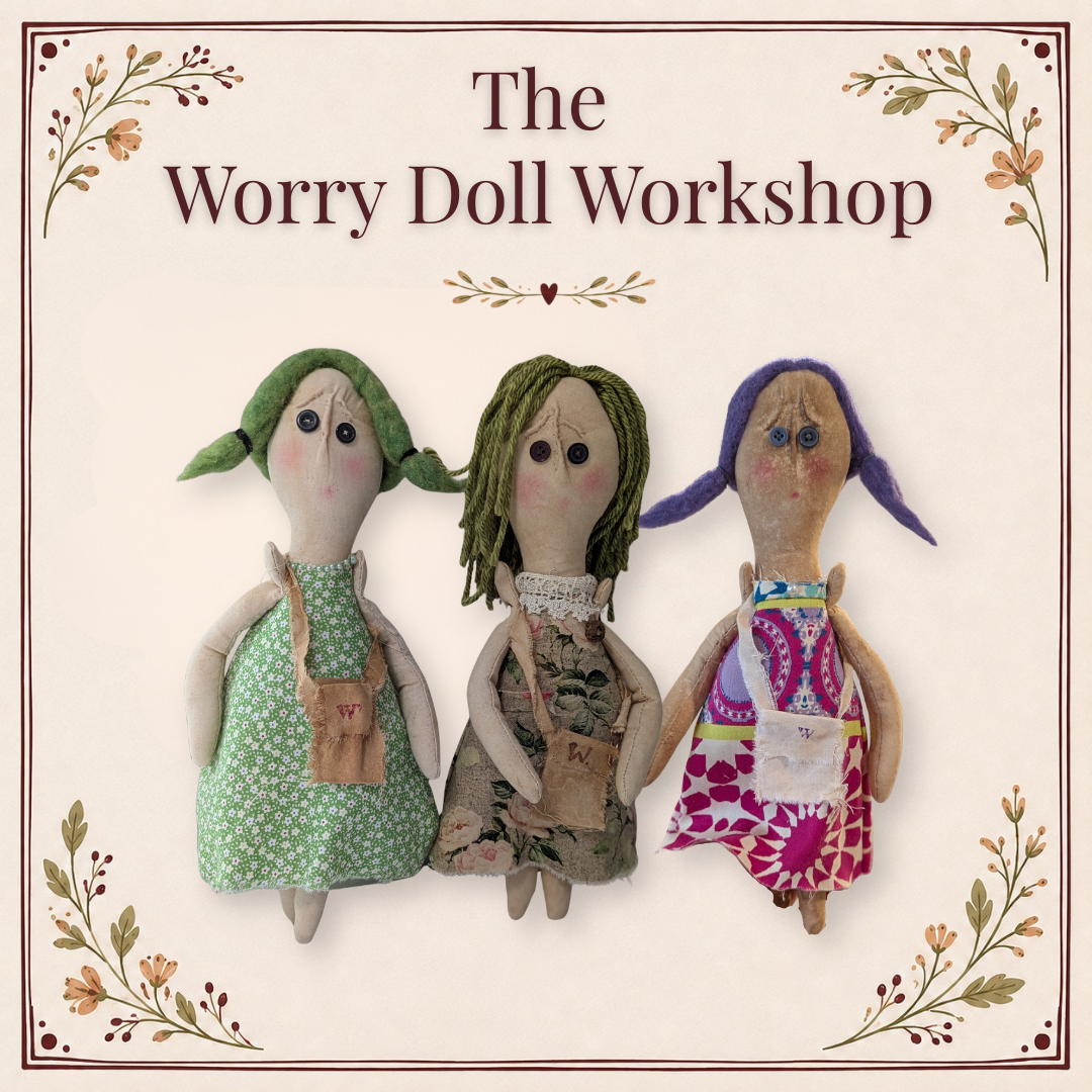 Three handmade Worry Dolls with fabric dresses and colorful yarn hair, displayed beneath the words “The Worry Doll Workshop” with floral corner decorations.