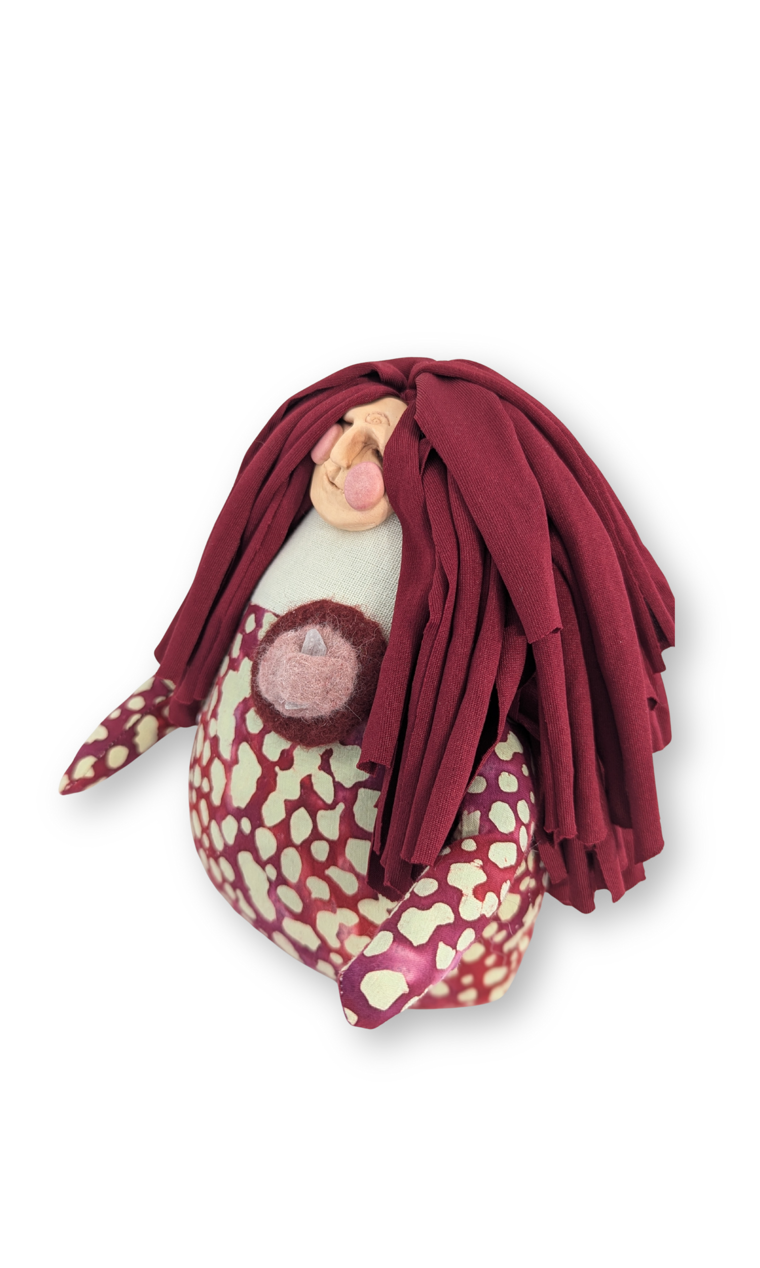 Side view of Peaceful Warrior guardian doll highlighting sculpted face and layered textiles