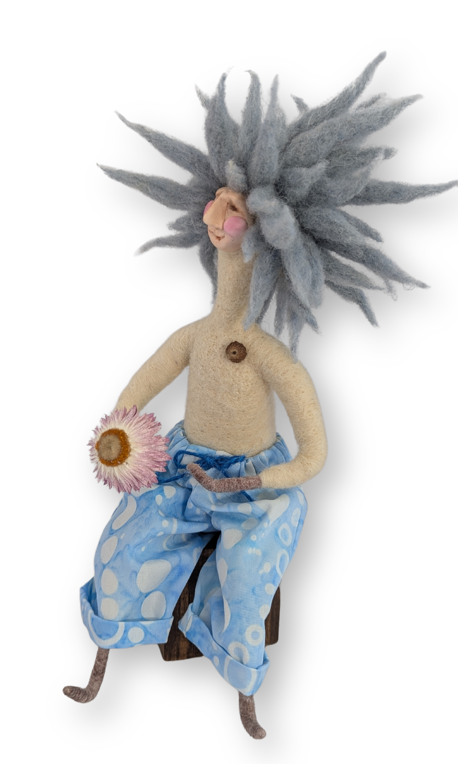 Angled view of Surfer Dude Guardian Doll, highlighting his playful expression, wool hair, and polka-dot pants.