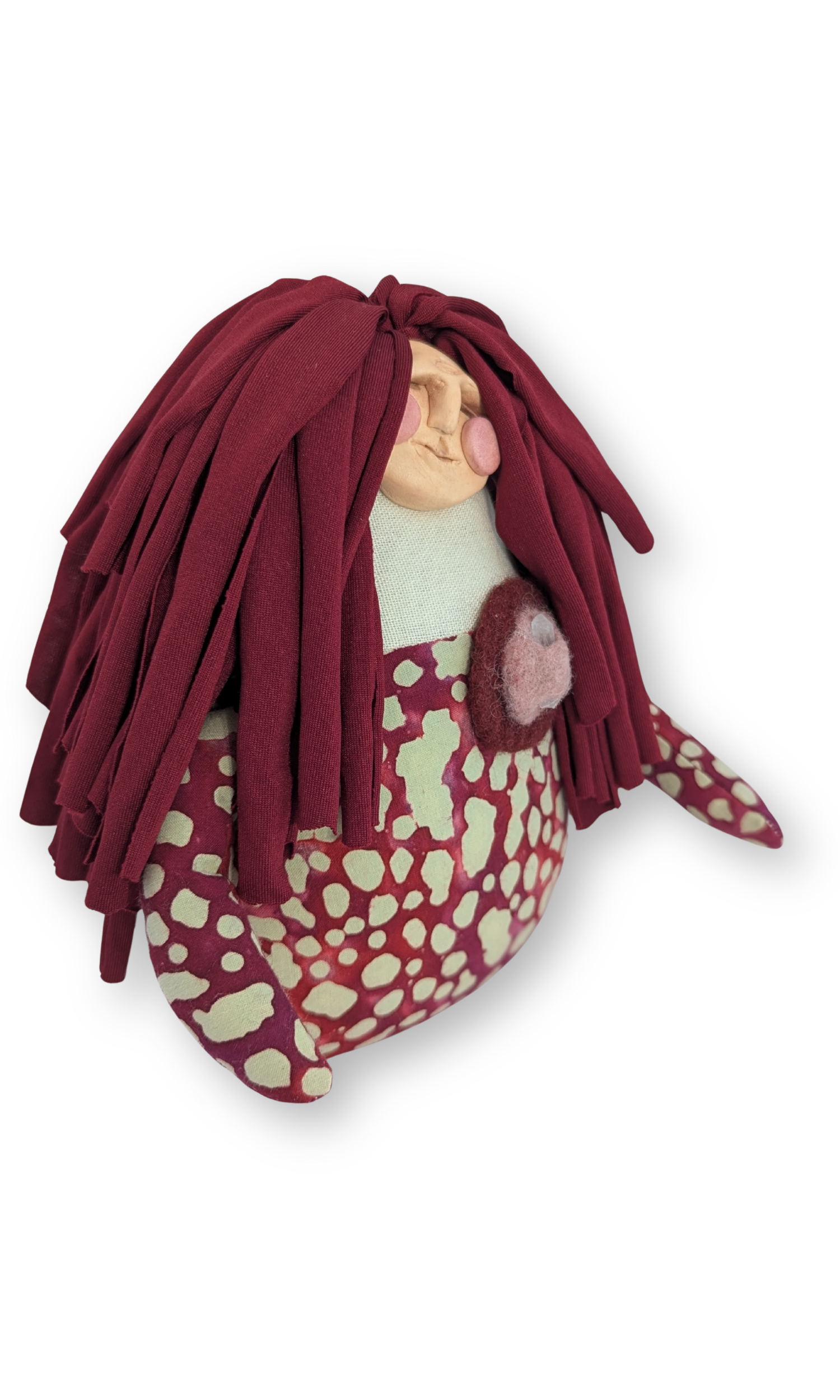 Angled view of Peaceful Warrior guardian doll showing detailed felted clothing and symbolic design