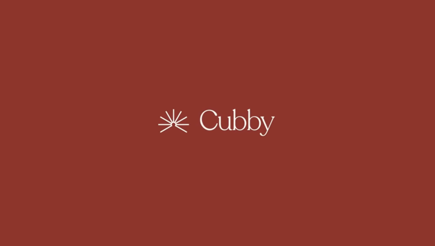 A brown background with a white logo consisting of a sunburst graphic and the word 'Cubby' next to it.