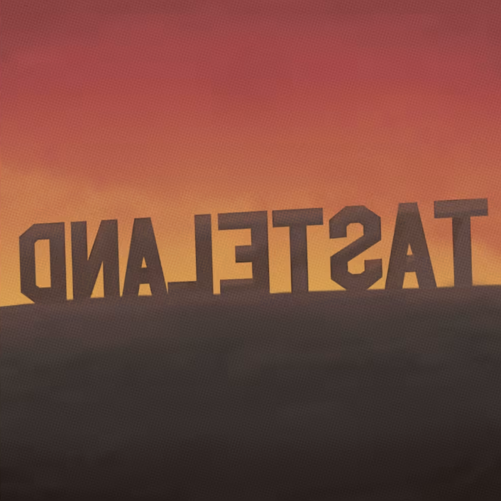 The word 'DESTINATION' written backwards against a sunset background.