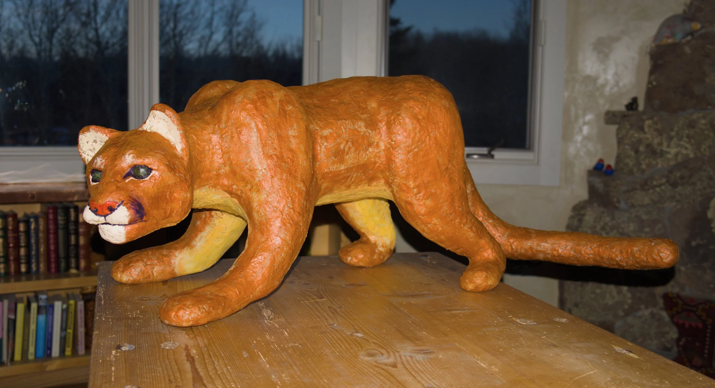Loretta the Mountain Lion (2026) • Wax, Encaustic, Apoxie-Sculpt, Jade • 48” x 28” x 28” • Alternate view. The lion has a mix of curiosity and malice in it's posture.