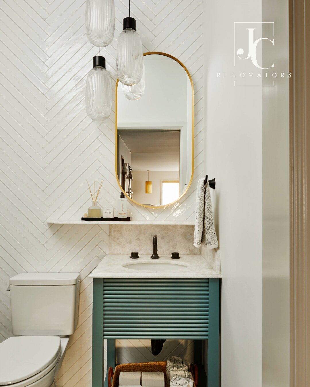 We took over the master closet to create this tiny guest powder bath.  The new layout allowed for a more functional space.  The herringbone tile and dramatic lighting were the icing on the cake.

Designer: @jcrenovators
Photographer: @andrewpetrich

