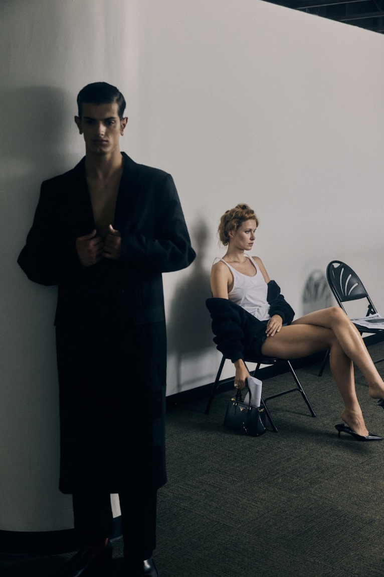 Tom (left) wears Strateas Carlucci coat and pants, Tod's shoes. Janet (right) wears Prada. 