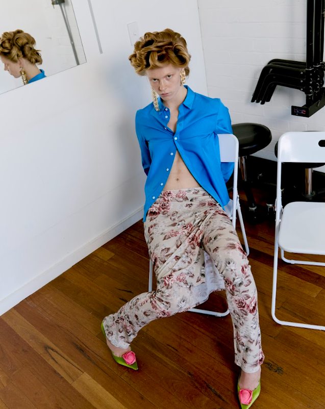 Model wears Celine shirt, Acne Studios skirt, Roger Vivier shoes, Valentino earrings.