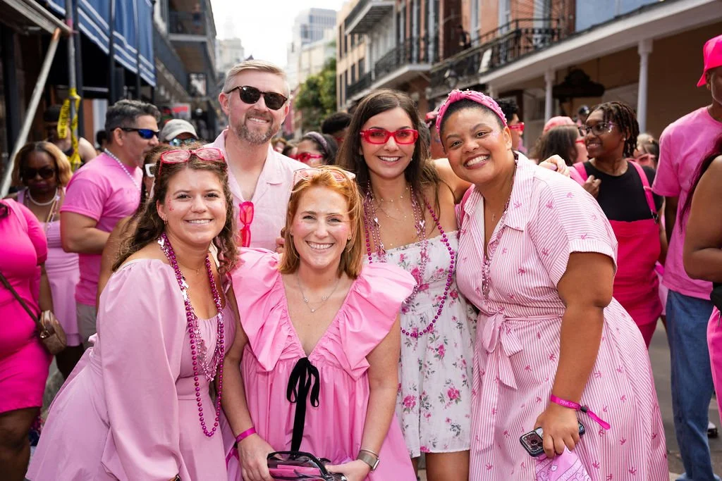 Friends dressed in pink at the Pink Dress Crawl in the French Quarter