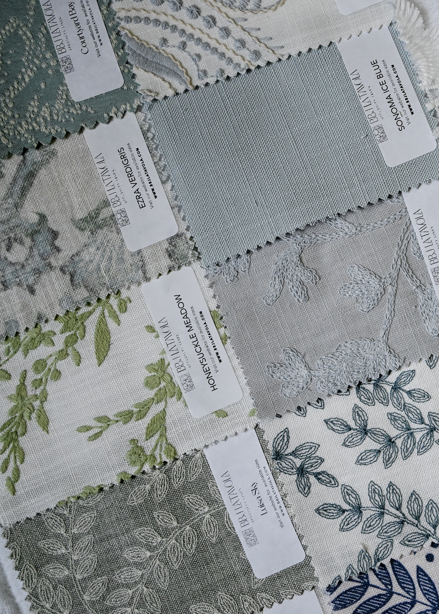 A collection of fabric swatches with different embroidery and woven patterns, labeled with fabric names and details.
