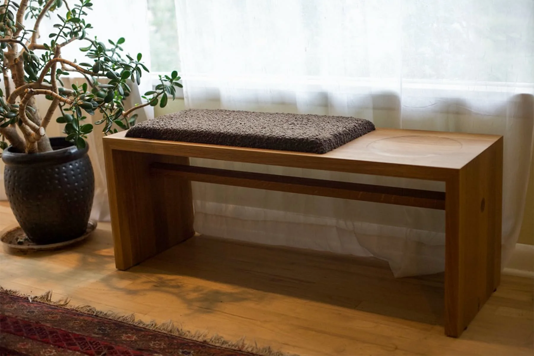 A few pictures of the three craters bench in rift sawn white oak. I was able to take some nice photos of the Seattle delivery - the diffuse natural light of the overcast Seattle skies make product photography really enjoyable. 

The upholstered pad i