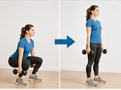 A woman in a blue shirt and black tights performing a dumbbell squat