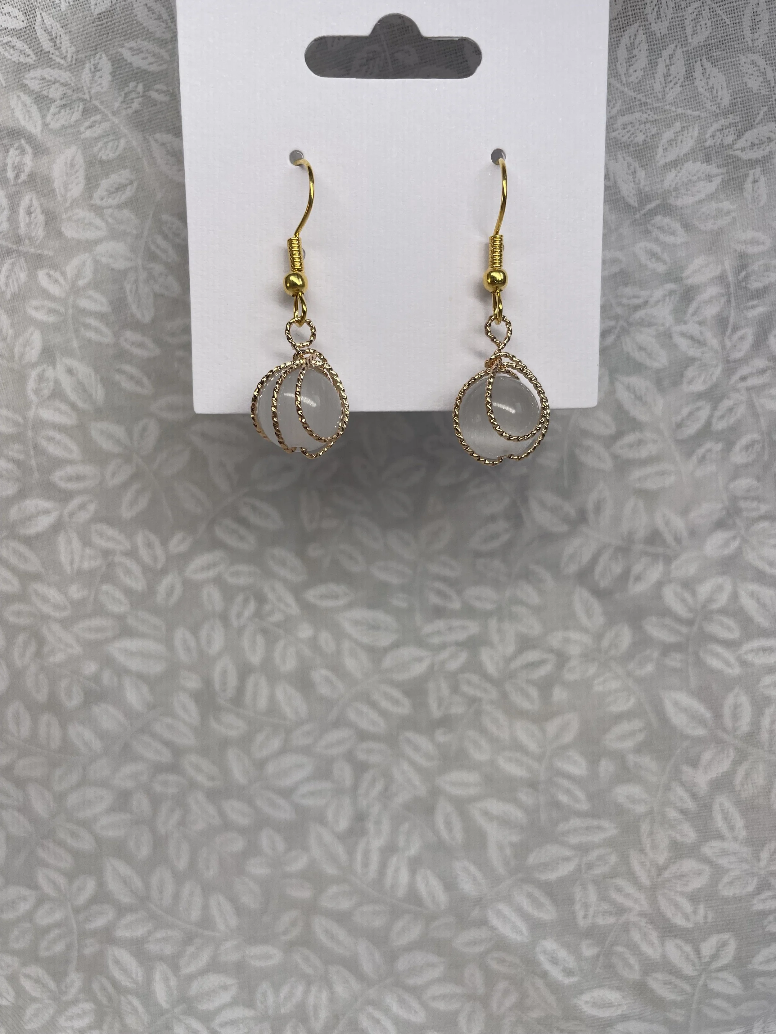 clear stone enwrapped in gold 2.JPG