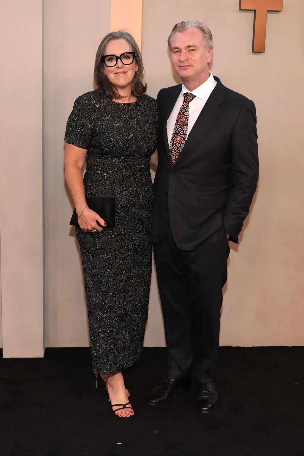 Emma Thomas and Christopher Nolan (wearing Zegna). 