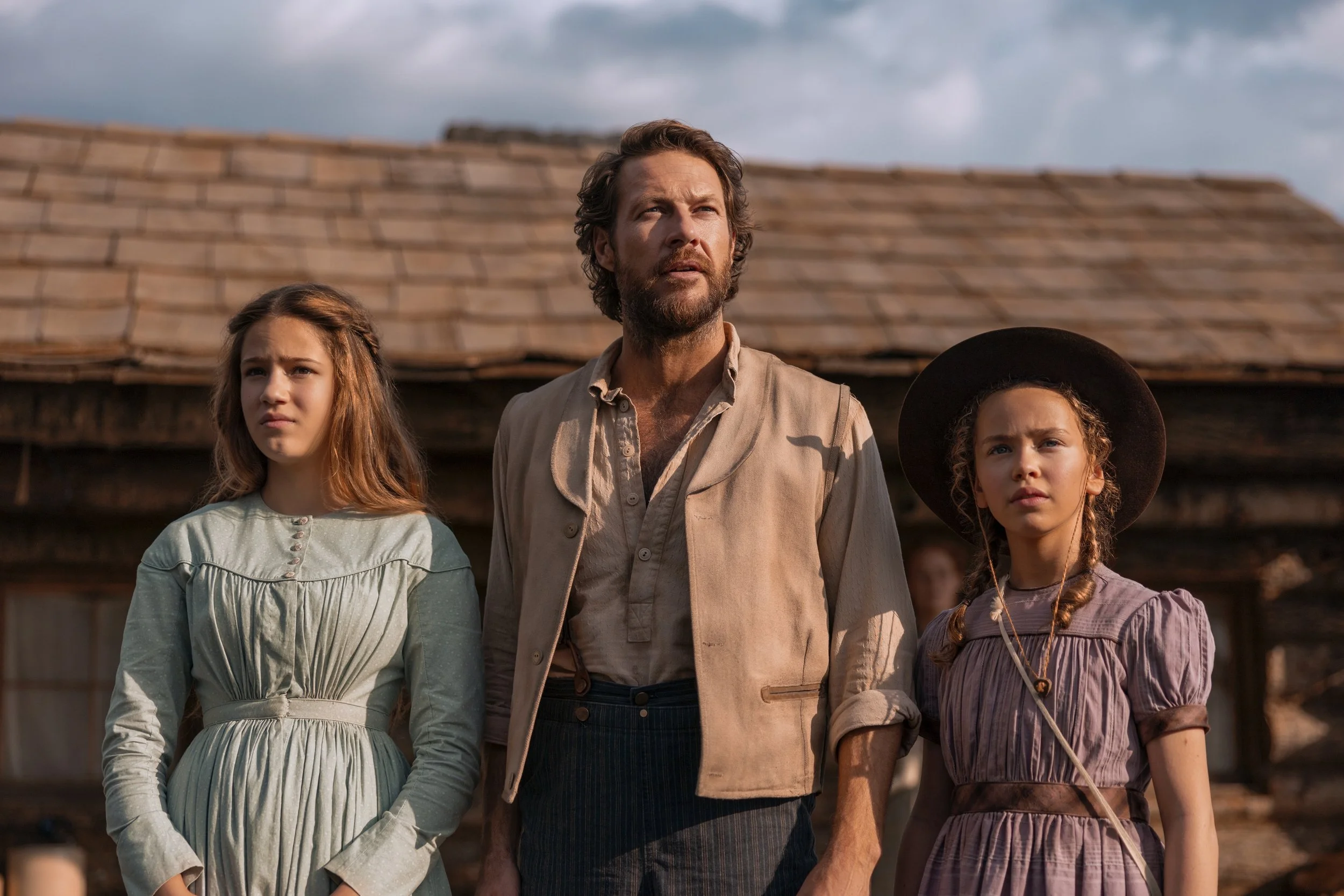 Little House on the Prairie. (L to R) Skywalker Hughes as Mary Ingalls, Luke Bracey as Charles Ingalls, Alice Halsey as Laura Ingalls in episode 107 of Little House on the Prairie. Cr. Eric Zachanowich/Netflix © 2026