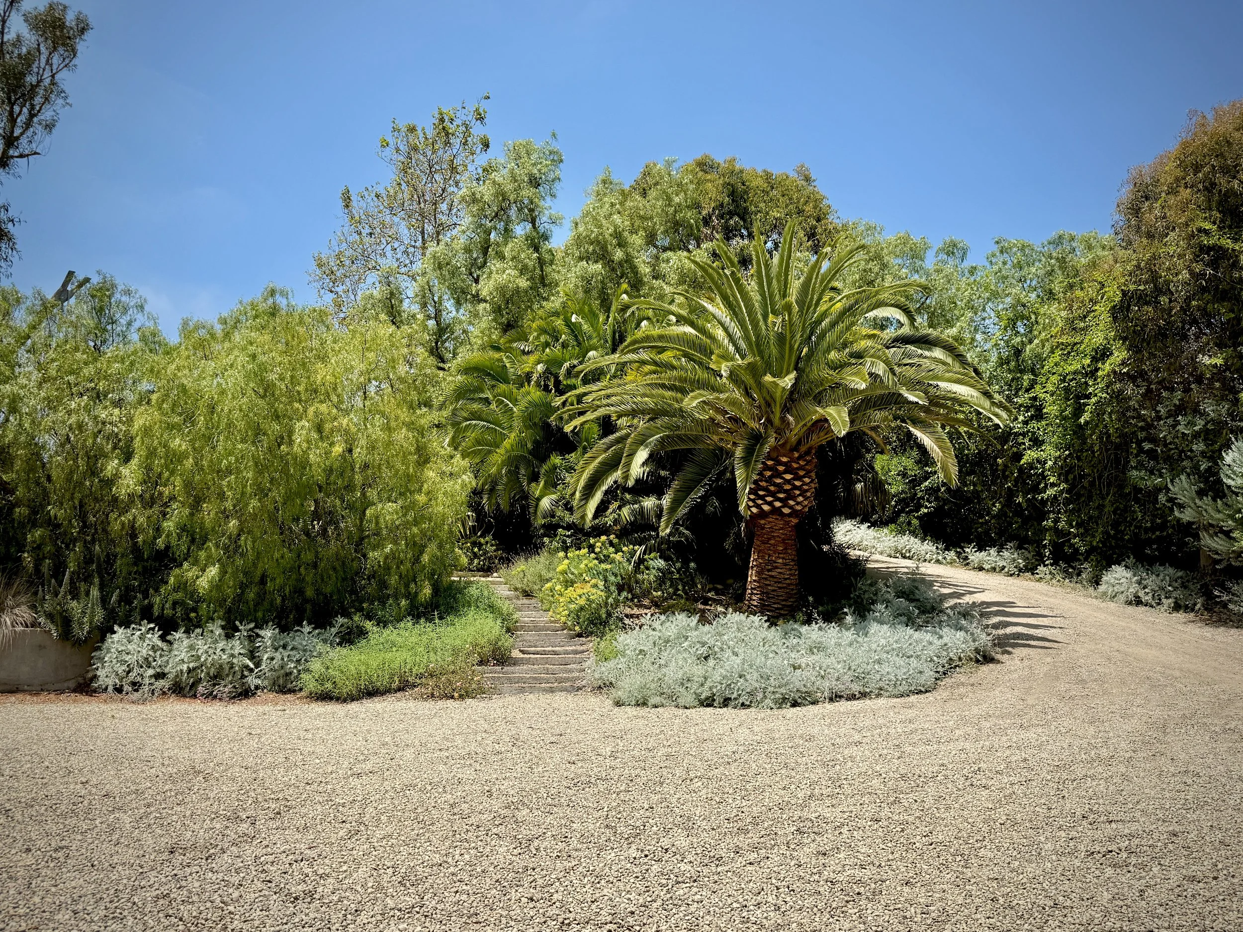outdoor filming location Malibu hills, Malibu exterior filming location, ocean view filming location Malibu, native plant garden filming location Malibu, stone pathway filming location Malibu, vintage Airstream filming location, covered pavilion film