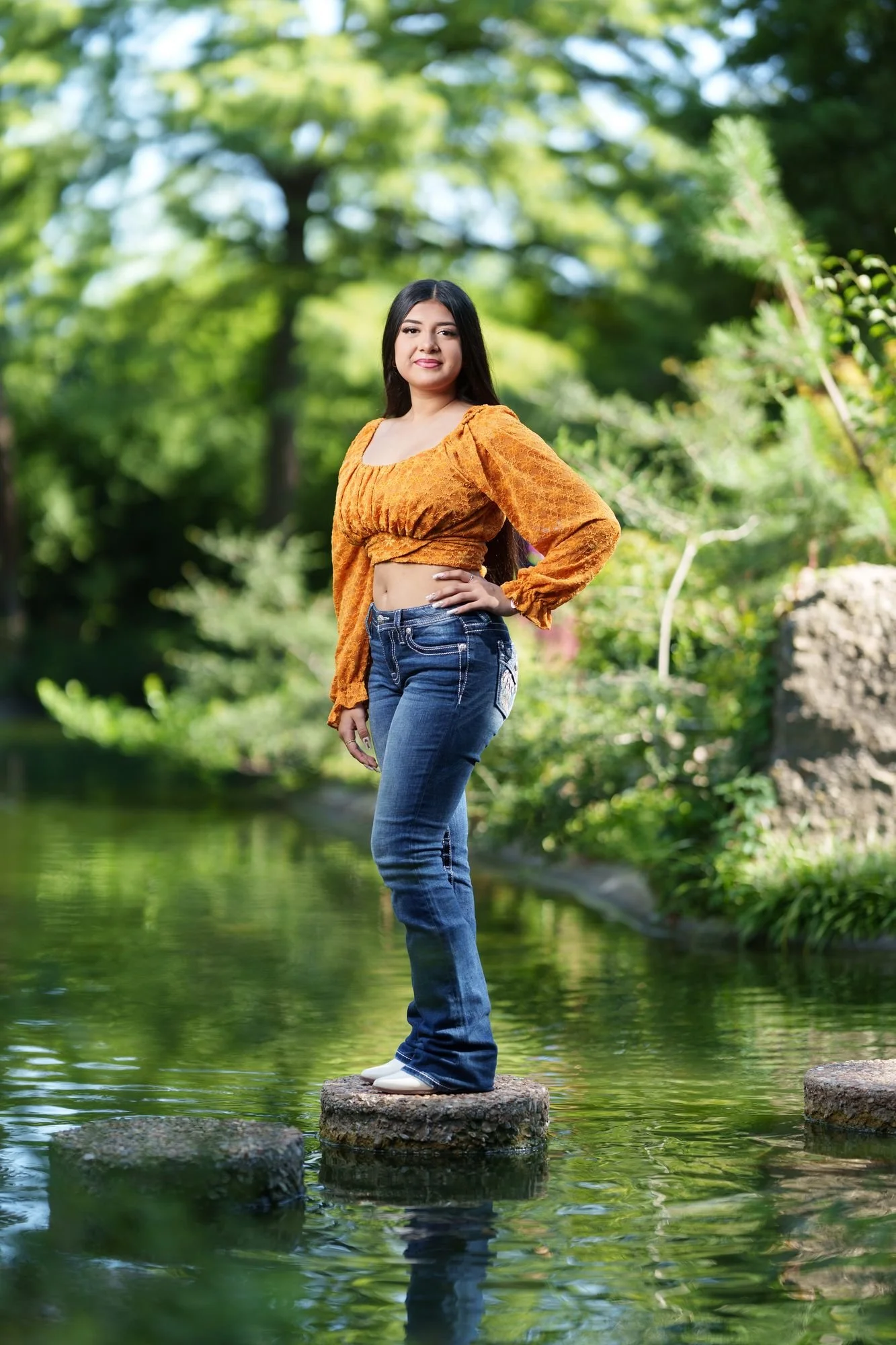 Burnt orange lace peasant top detail from Nevaeh's boho western quinceañera Save the Date at Fort Worth Botanic Garden