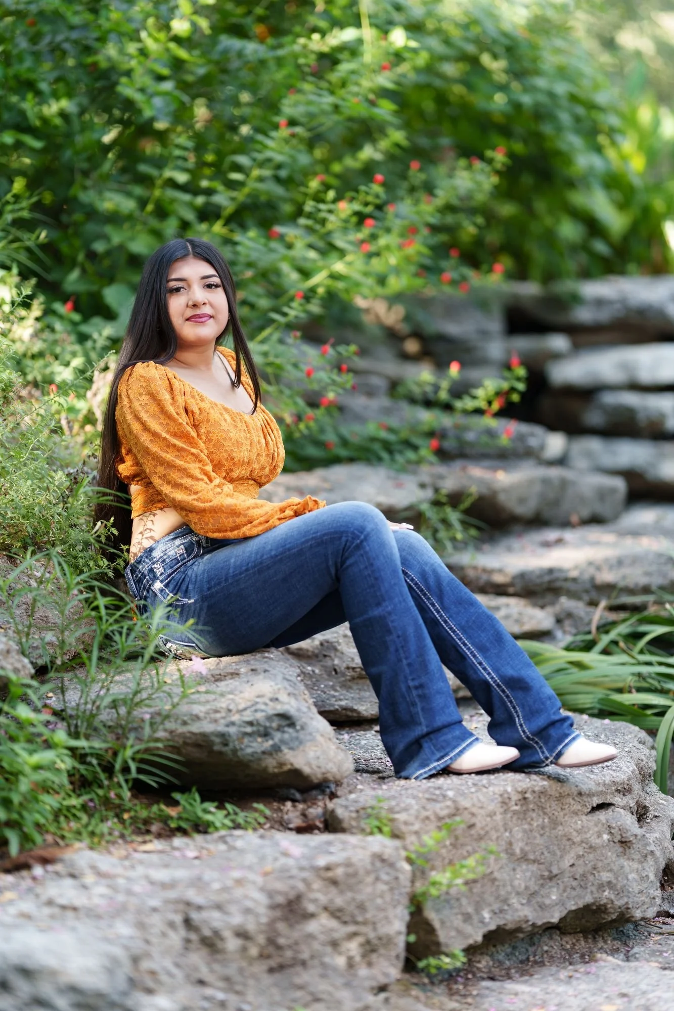 Bootcut jeans and cream booties styling on Nevaeh's Save the Date at Fort Worth Botanic Garden