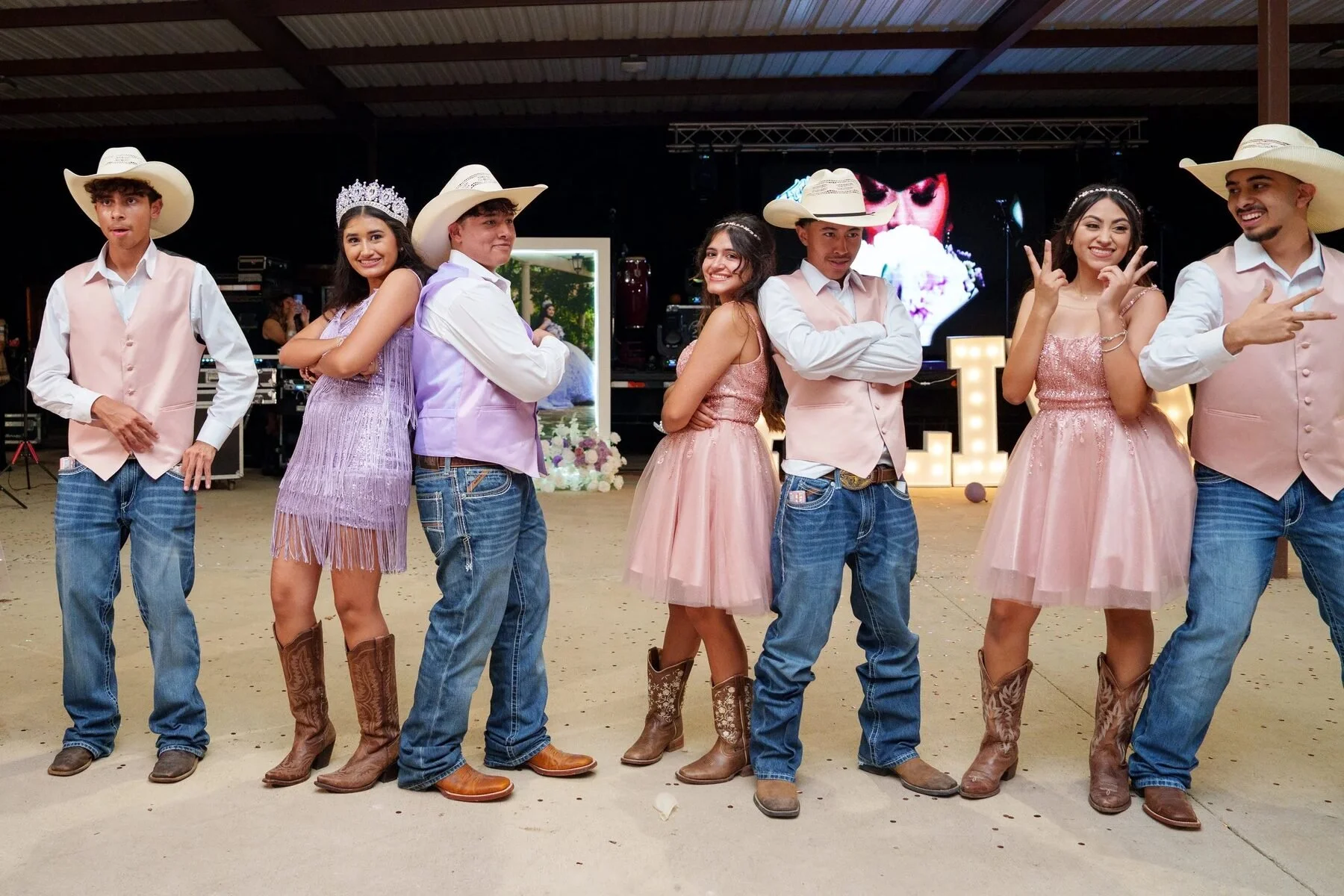 Quinceañera court of honor posing in western attire at a Fort Worth reception
