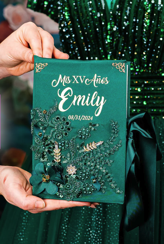 Personalized quinceañera Bible with green cover and gold details held during a quinceañera celebration