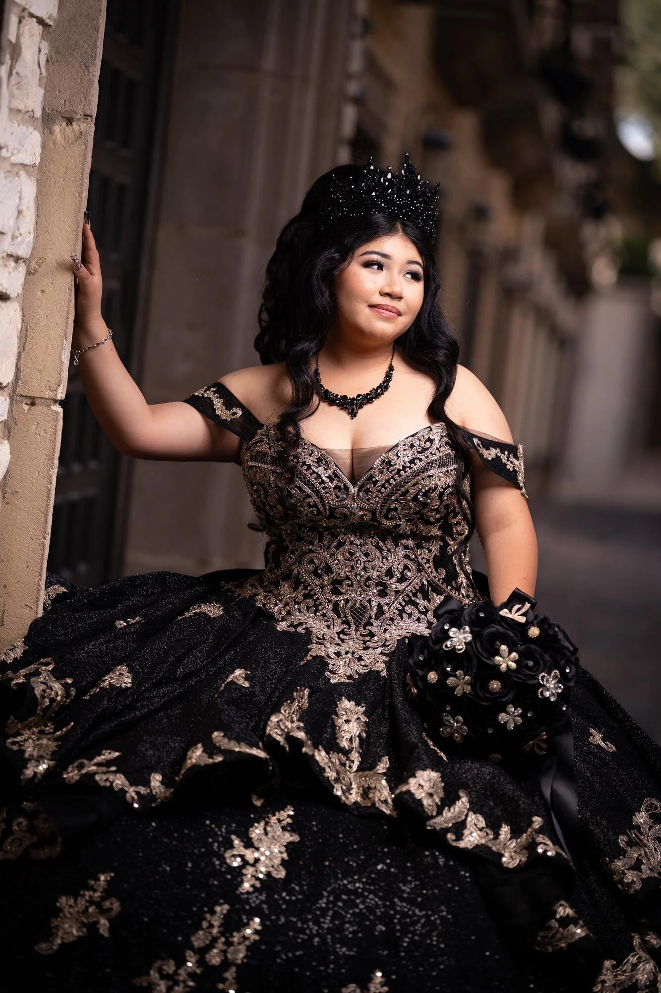 Black and gold sequin quinceañera gown full-length portrait at Mandalay Canal Irving Texas preshoot