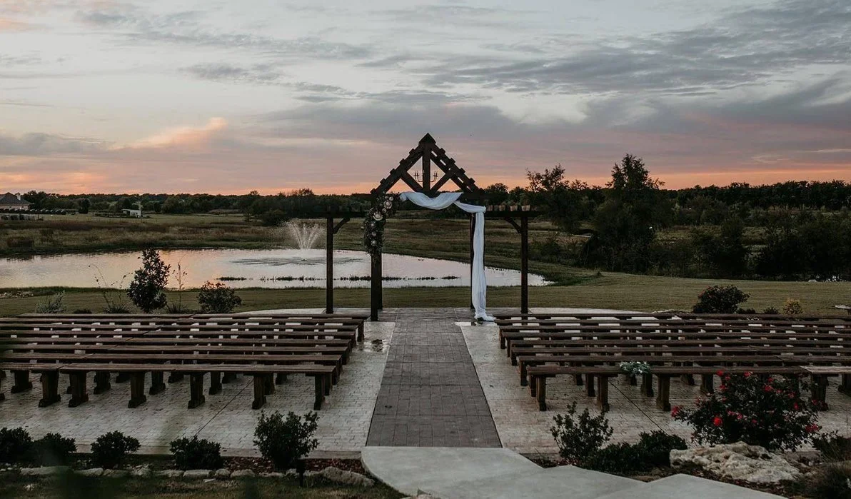 Outdoor quinceañera blessing venue with rustic pergola and pond at Hawthorne Hills in DFW at sunset