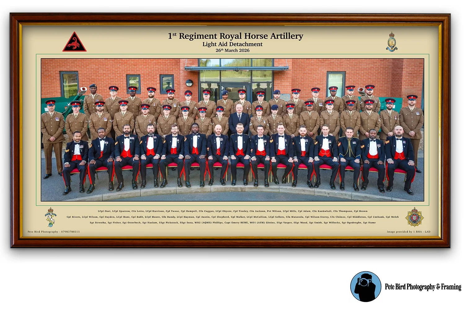 Group photograph of personnel from 1st Regiment Royal Horse Artillery Light Aid Detachment, taken outdoors in front of a brick building, with individuals in military uniforms and formal attire, some seated and others standing.