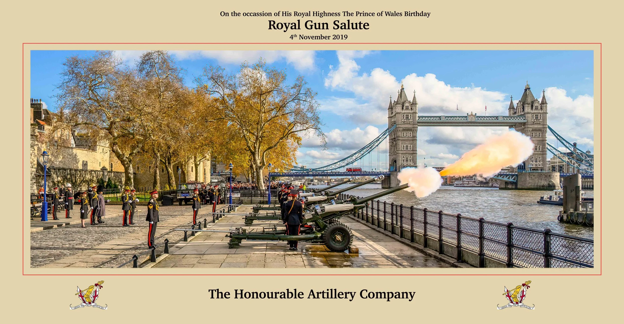 A commemorative plaque with a picture of a military salute involving artillery cannons and soldiers in dress uniform on a riverside with Tower Bridge in the background, celebrating the Prince of Wales' birthday on November 4, 2019.