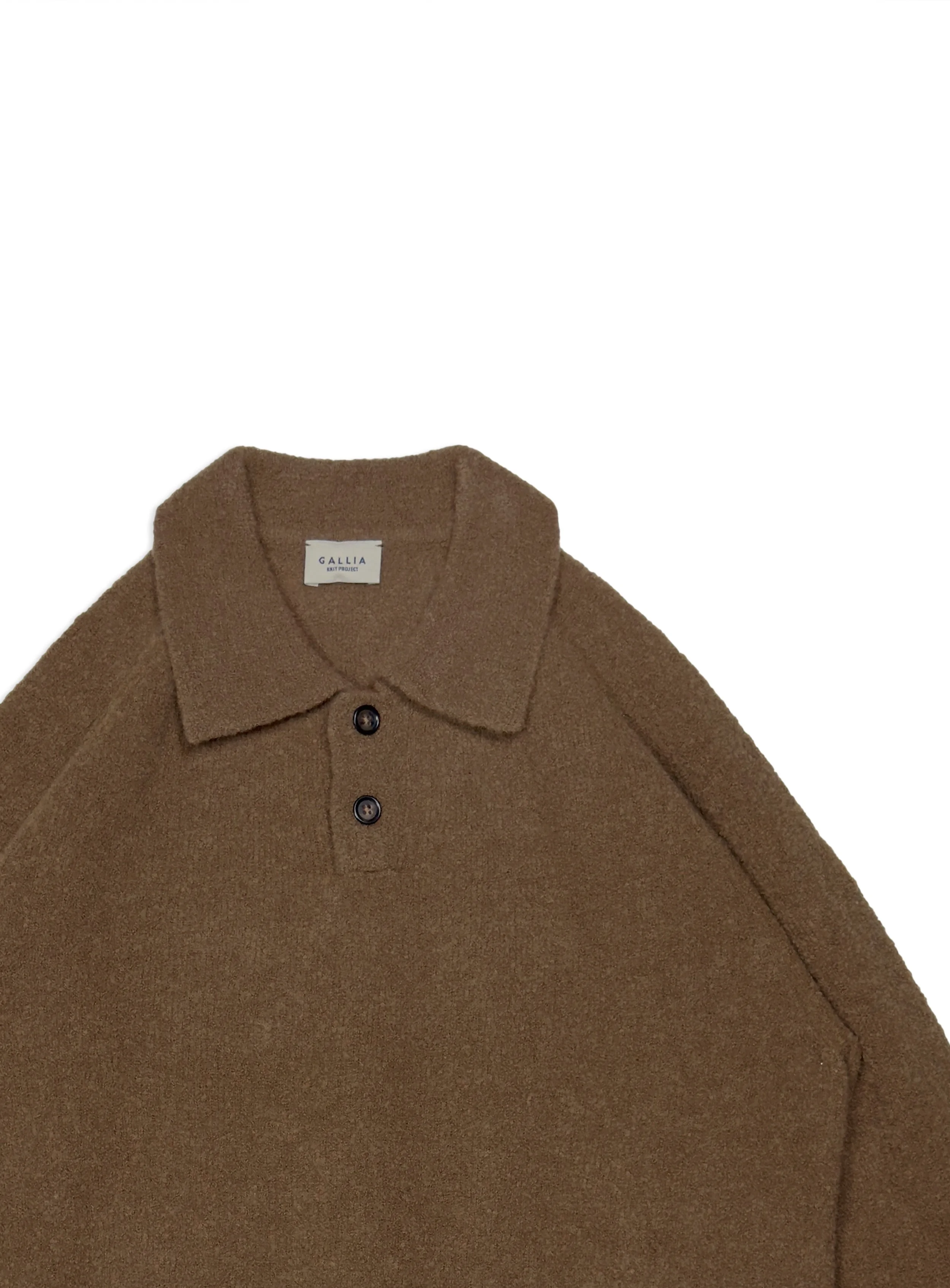 Polo Gallia bouclé in calda e morbida lana tinta unita. Maglia di ispirazione vintage.