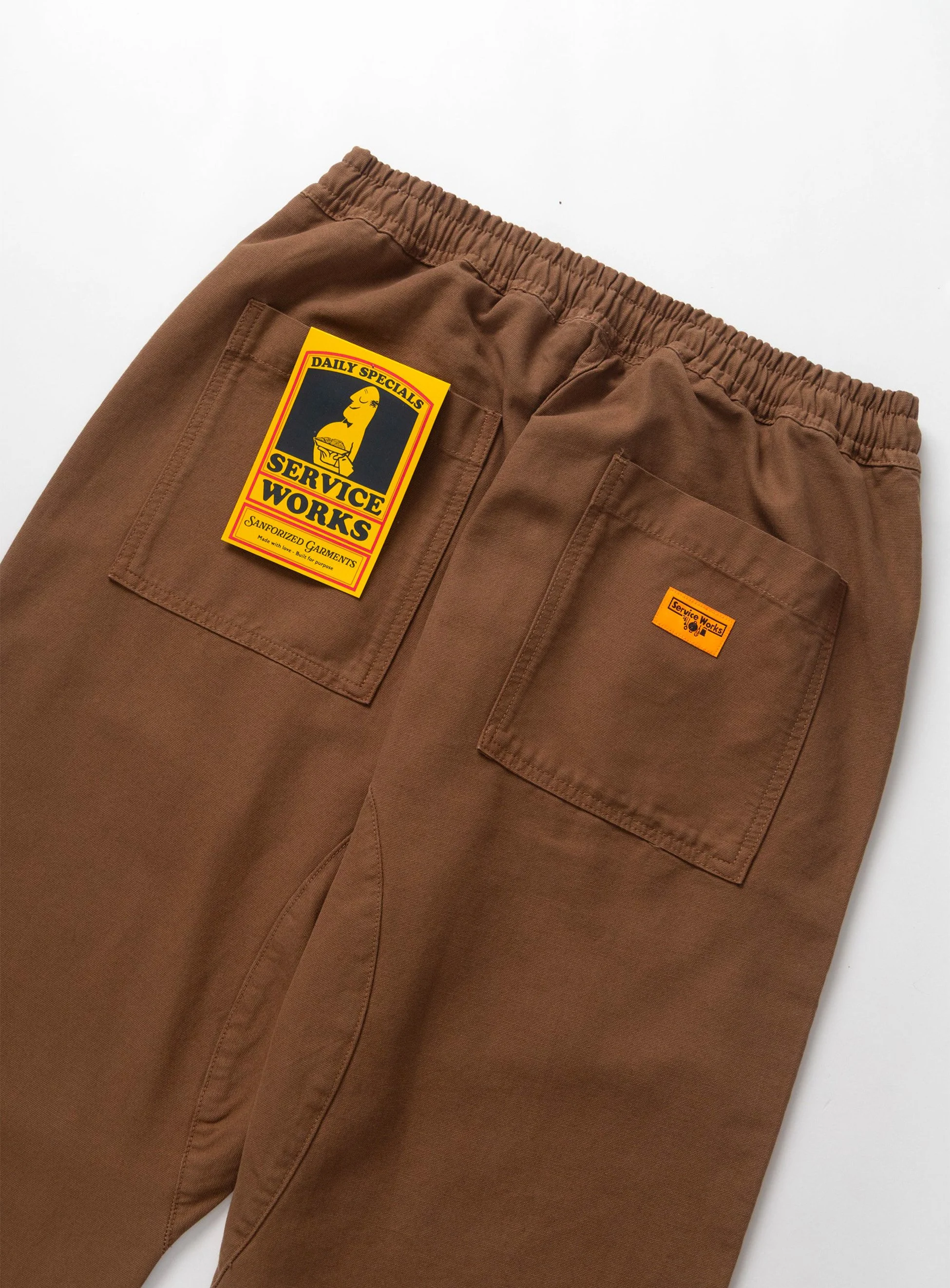 Pantalone Service Works in cotone canvas tinta unita. Capo ispirato agli indumenti da lavoro delle cucine londinesi.