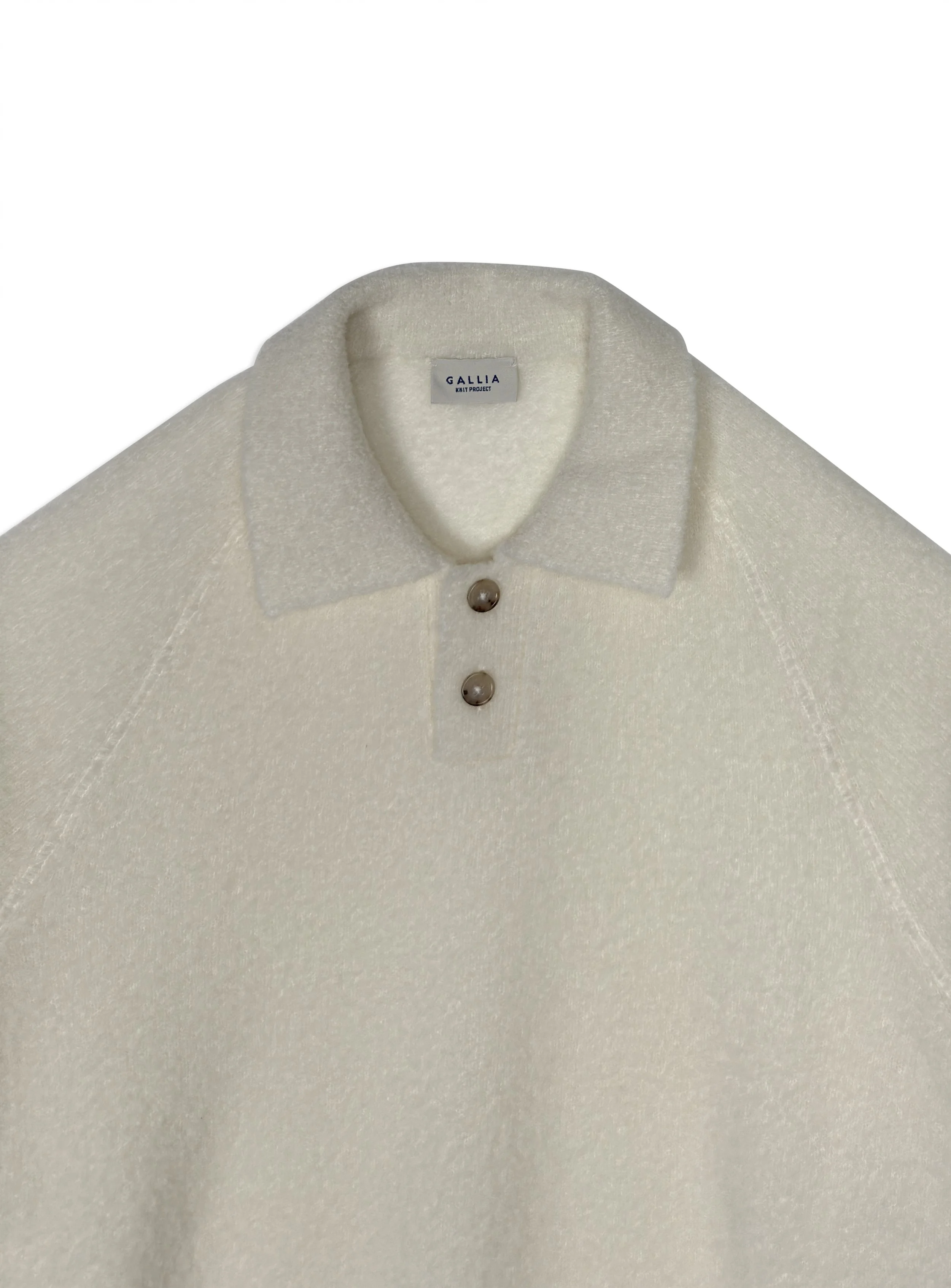 Polo Gallia a fantasia in calda e morbida lana tinta unita. Maglia di ispirazione vintage.