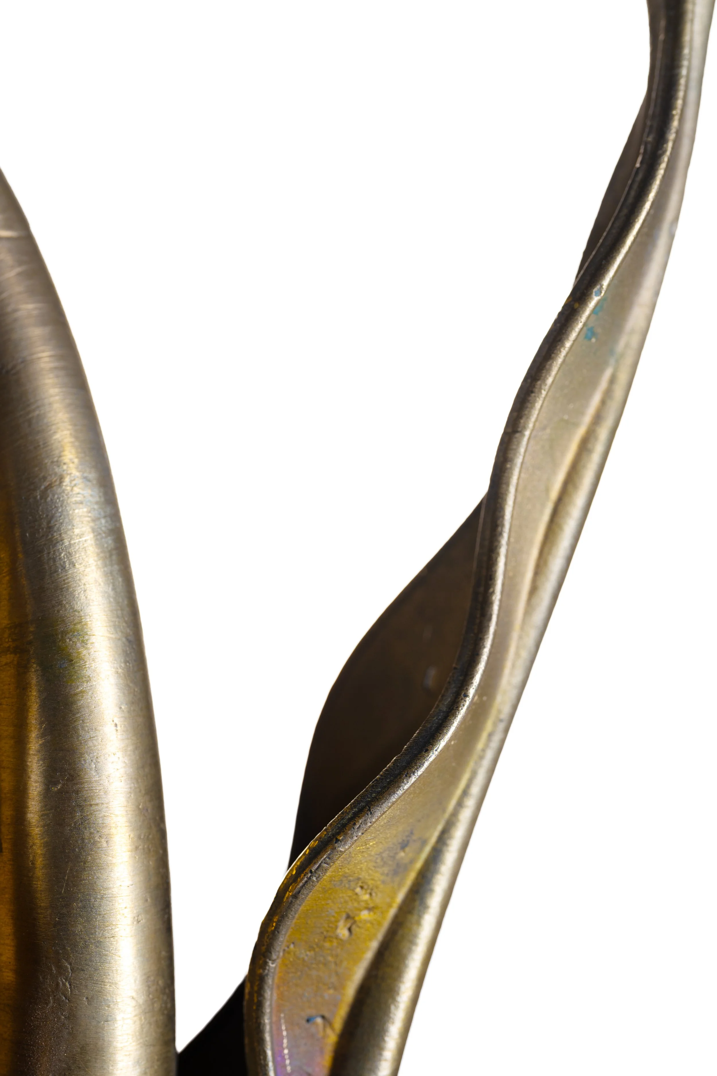 Close-up of metal spoons with a white background.