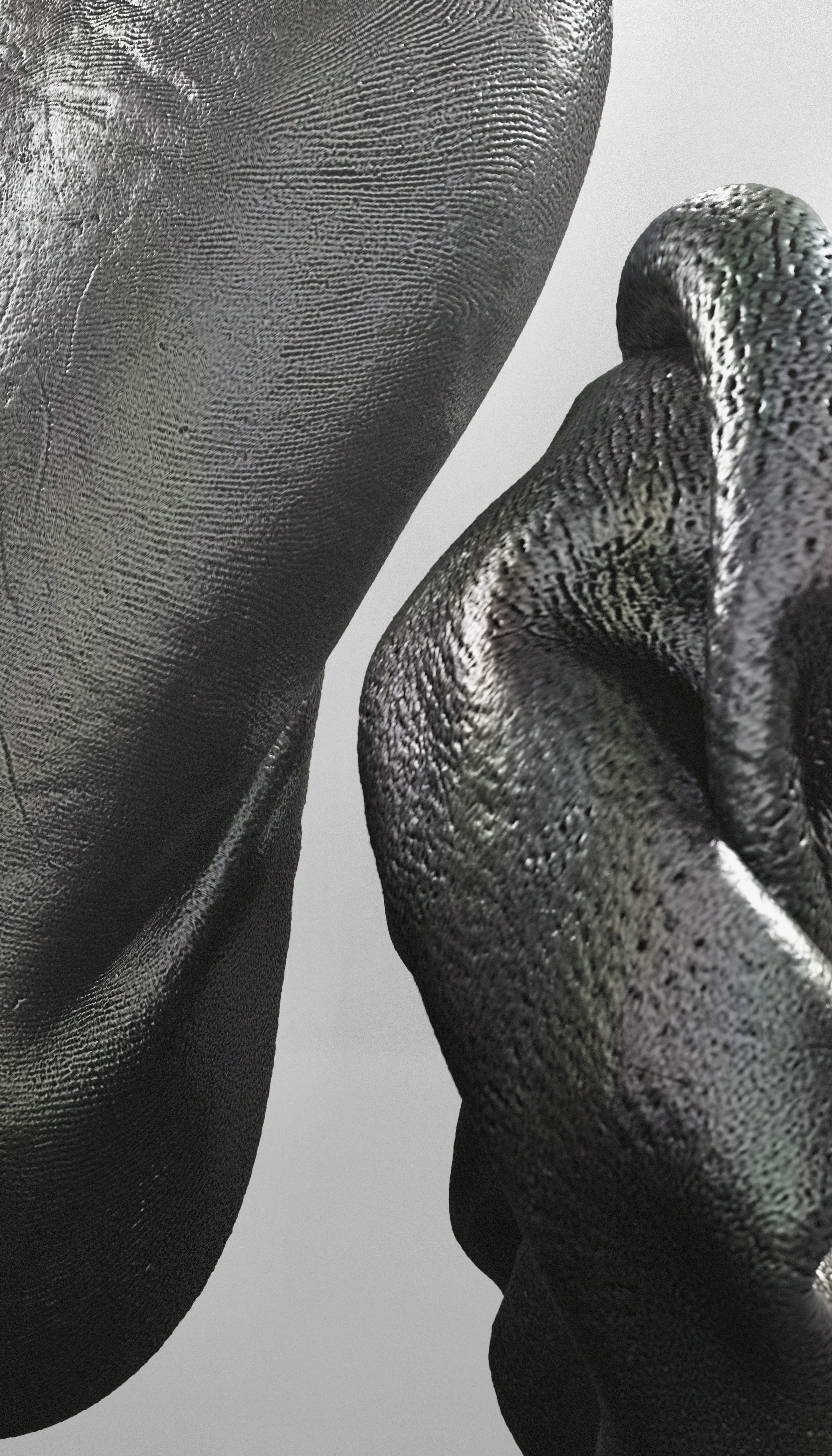 Close-up of two fingers touching, both coated in shiny metallic black paint, showing textured skin details.