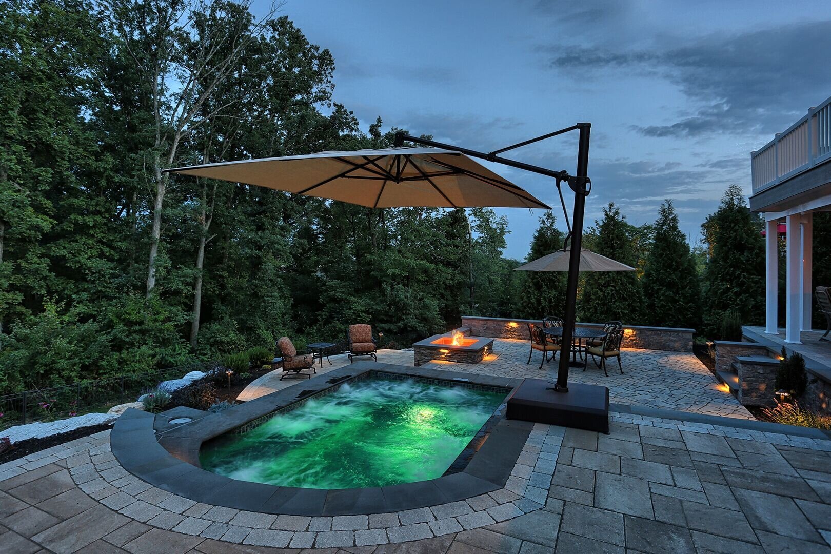Luxury backyard featuring an outdoor jacuzzi, enhancing the overall appeal of the home.