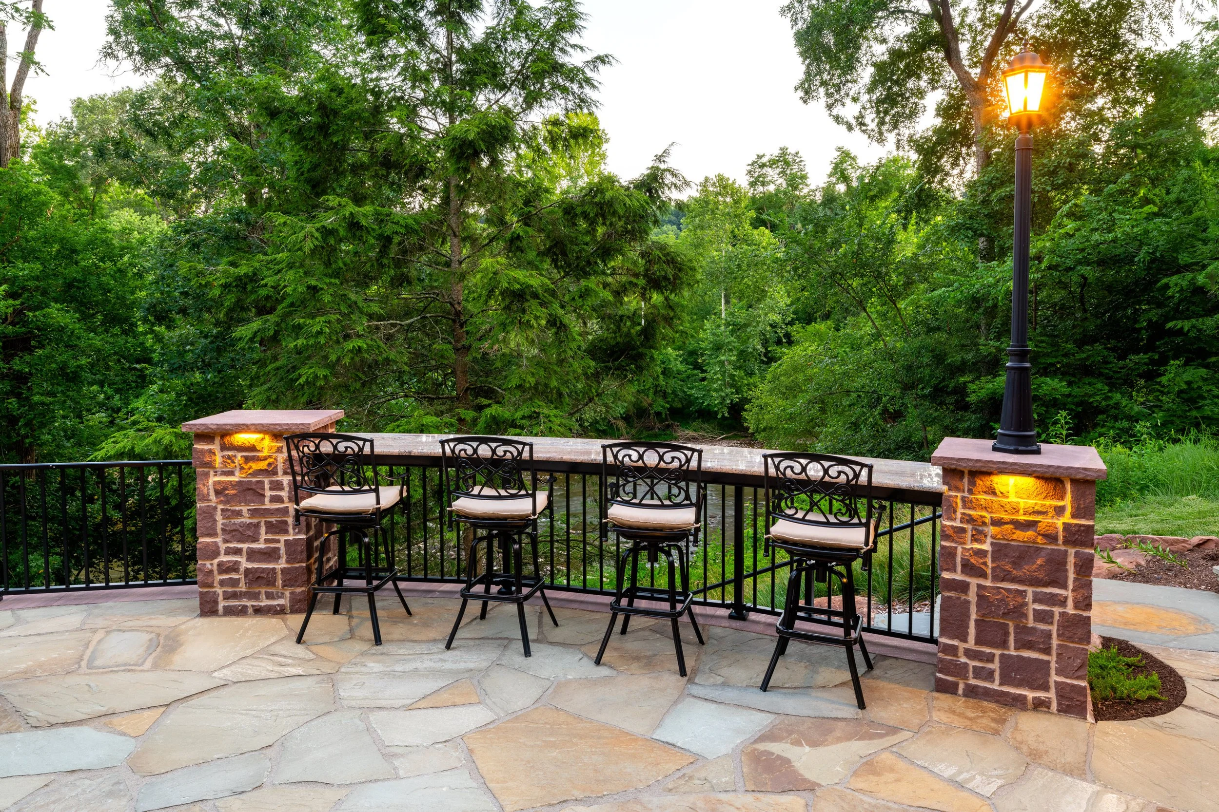 Stone pillars with cap lights framing an outdoor bar area, Boiling Springs, PA
