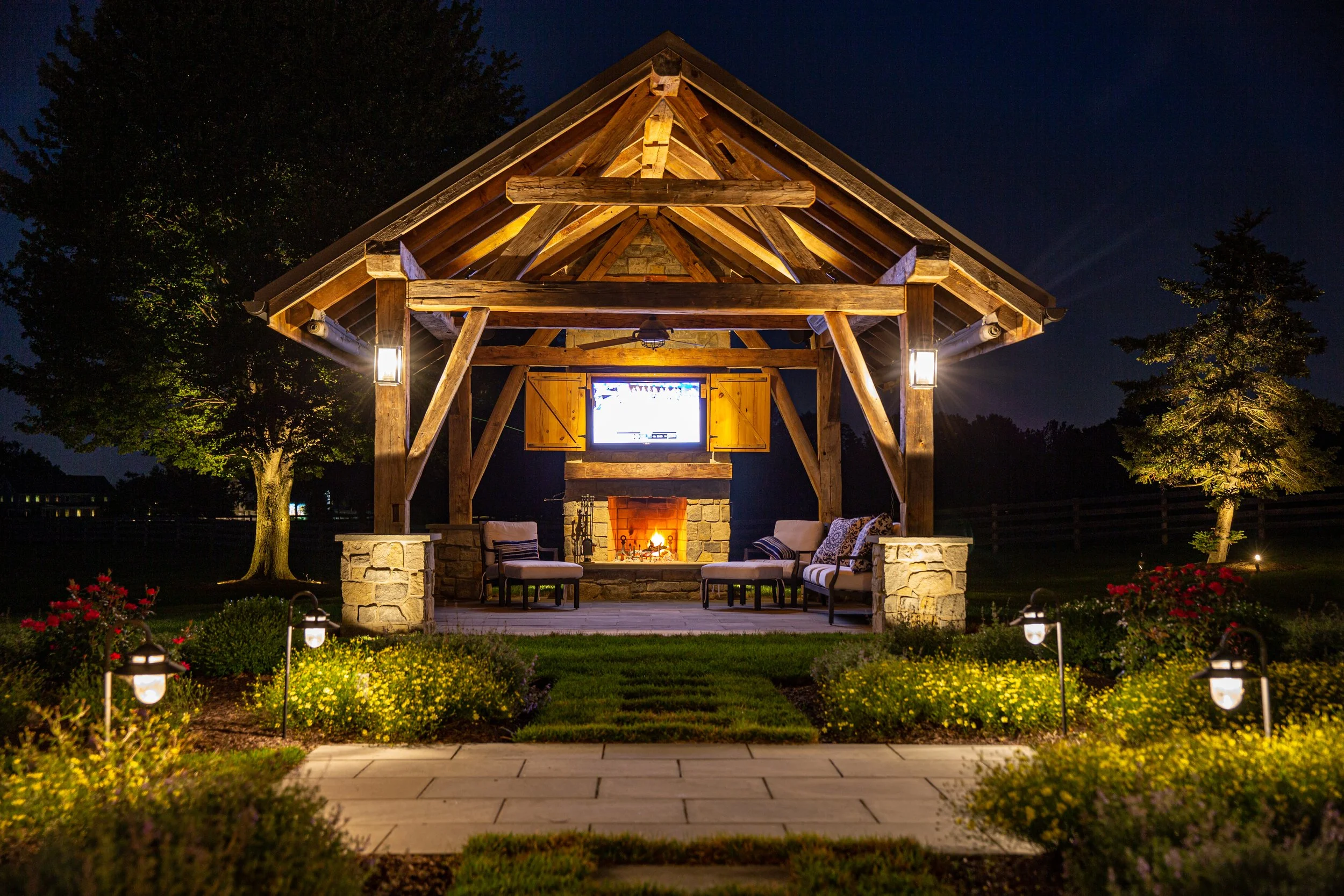 Well-lit backyard with professionally installed lighting system