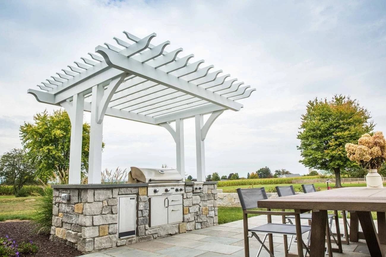 Wooden pavilion installed in landscaped backyard