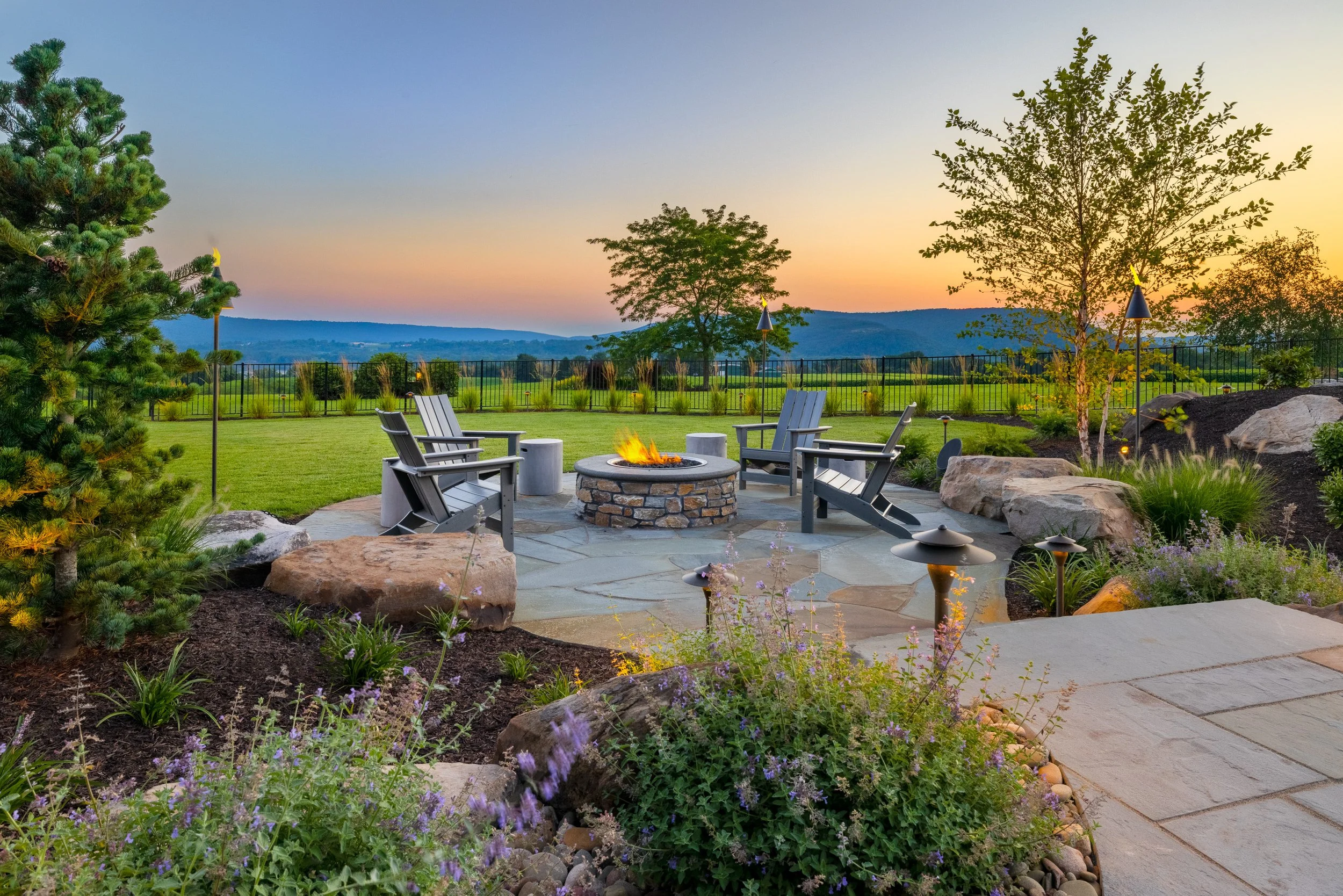 Warm outdoor lighting highlighting garden features at night