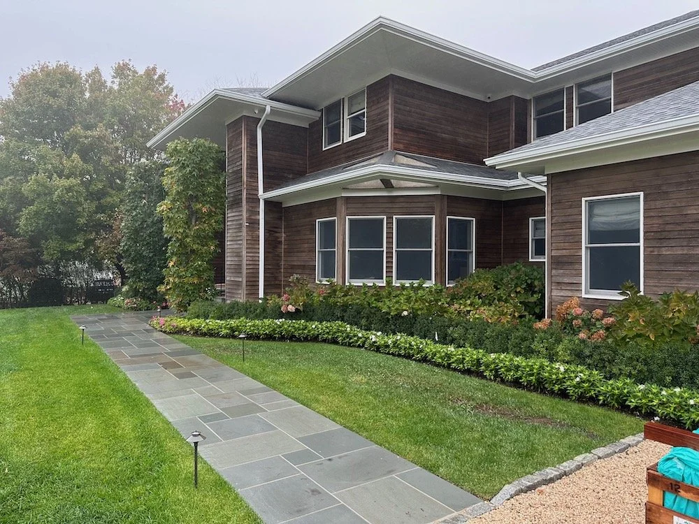 A paver walkway leading up to a home entrance