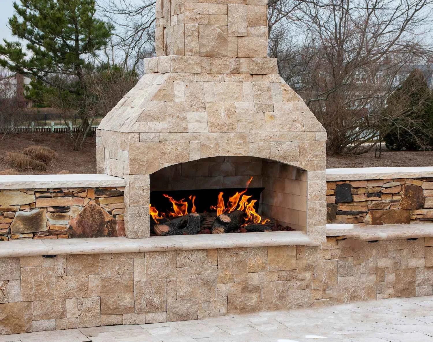 A stone outdoor fireplace in Westchester County, NY