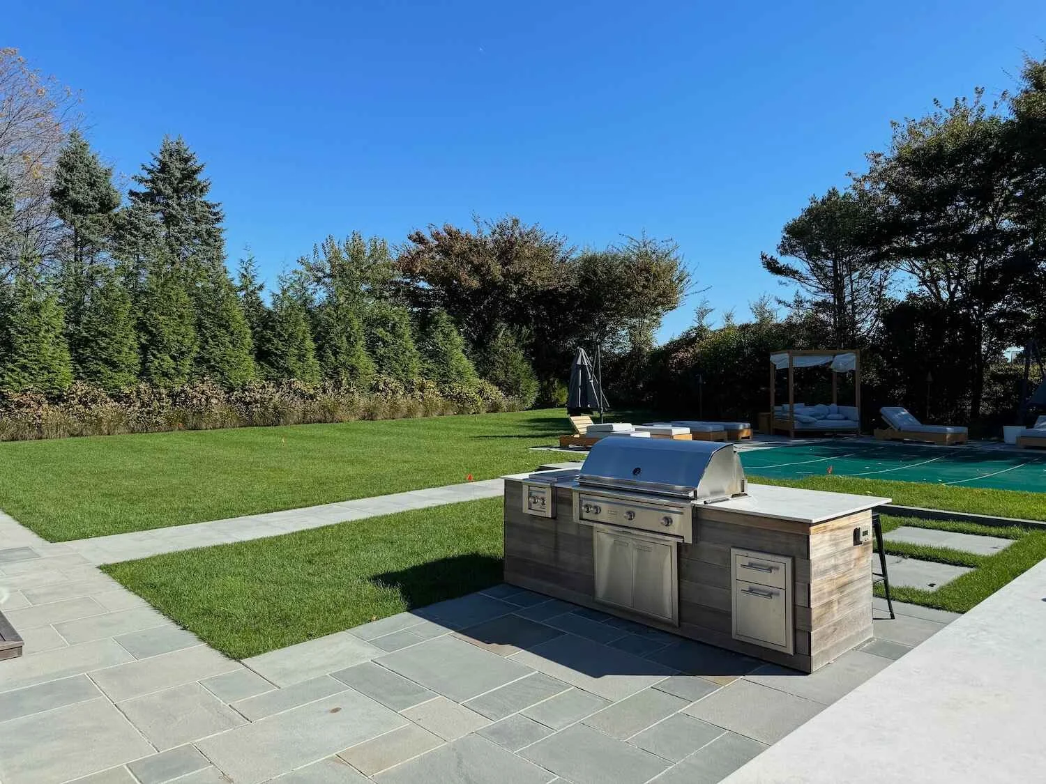 An outdoor kitchen with built in grill in Westchester County, NY