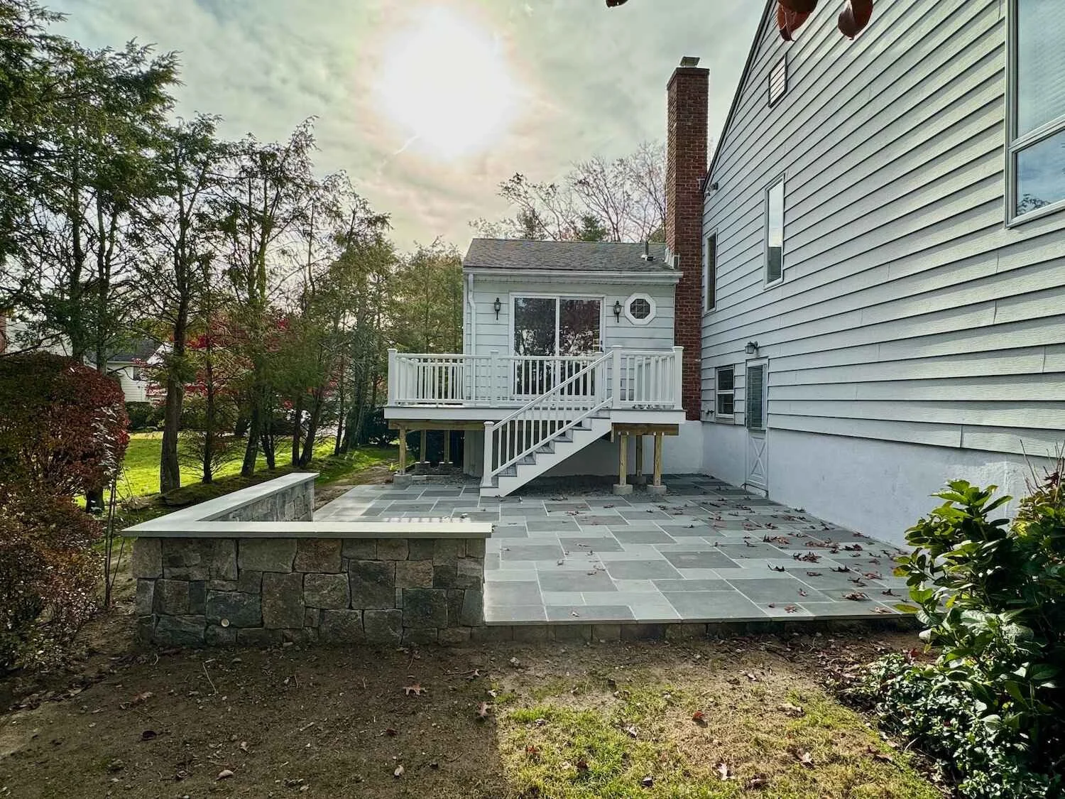 A large residential paver patio and retaining wall in Westchester County, NY