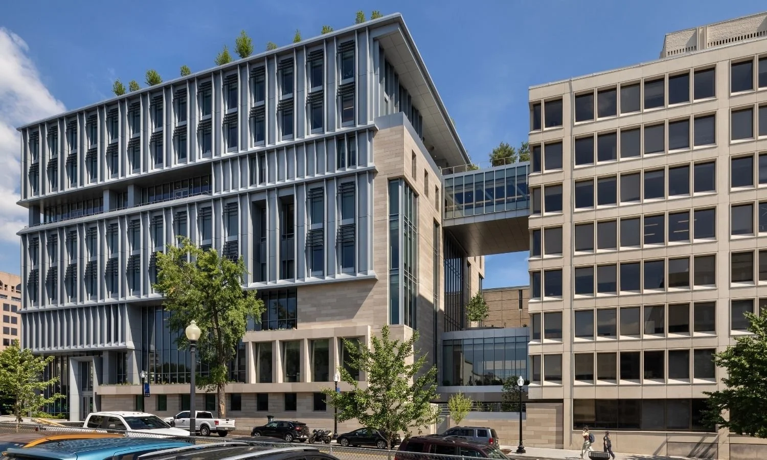 Rooftop Trees and greenery line the top of Georgetown University's McCourt School of Public Policy that are planted in PureModern Custom Metal Planters